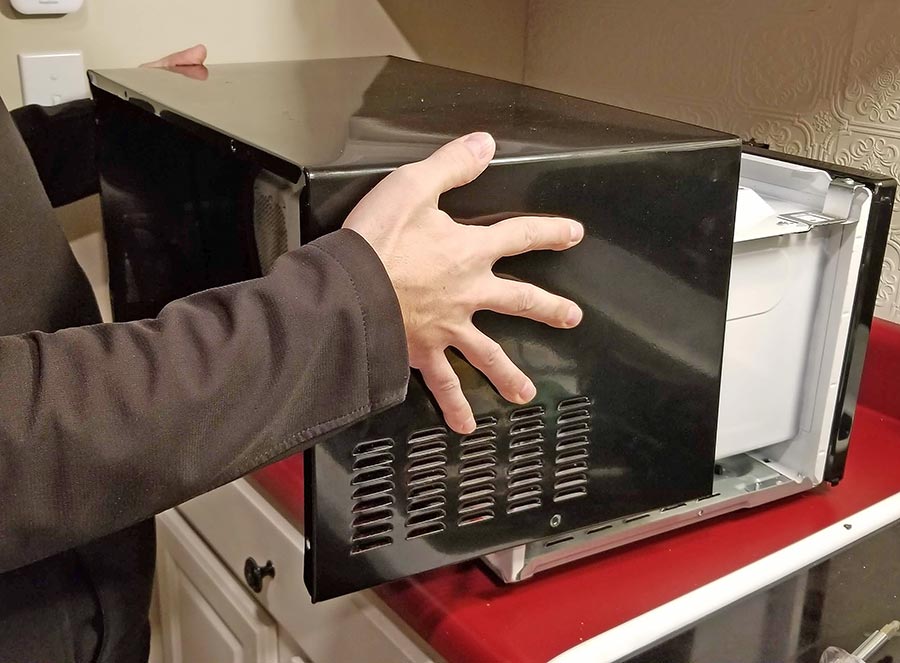 Removing cover from microwave