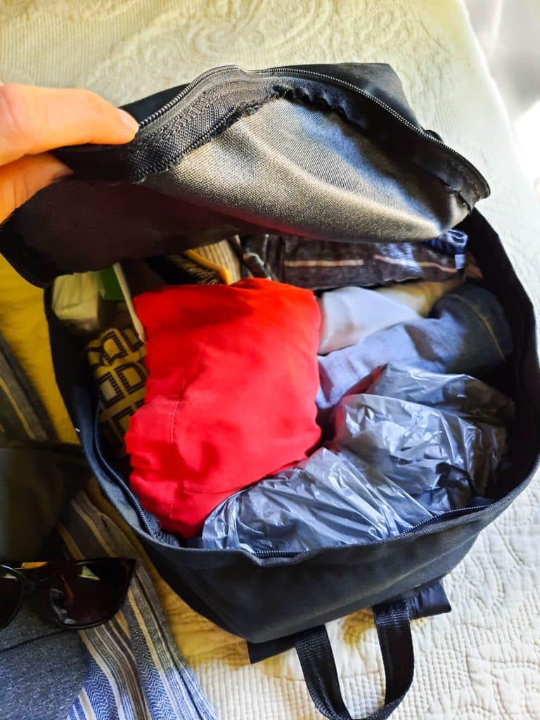 Image of a backpack full of clothes